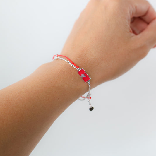 Monkey zodiac red string bracelet with silver chain, close-up detail - Crowned