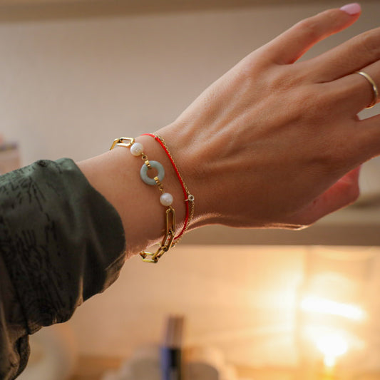 Beauty and Affluence Bracelet with Grade A Burmese jade and freshwater pearls, flat lay - Crowned
