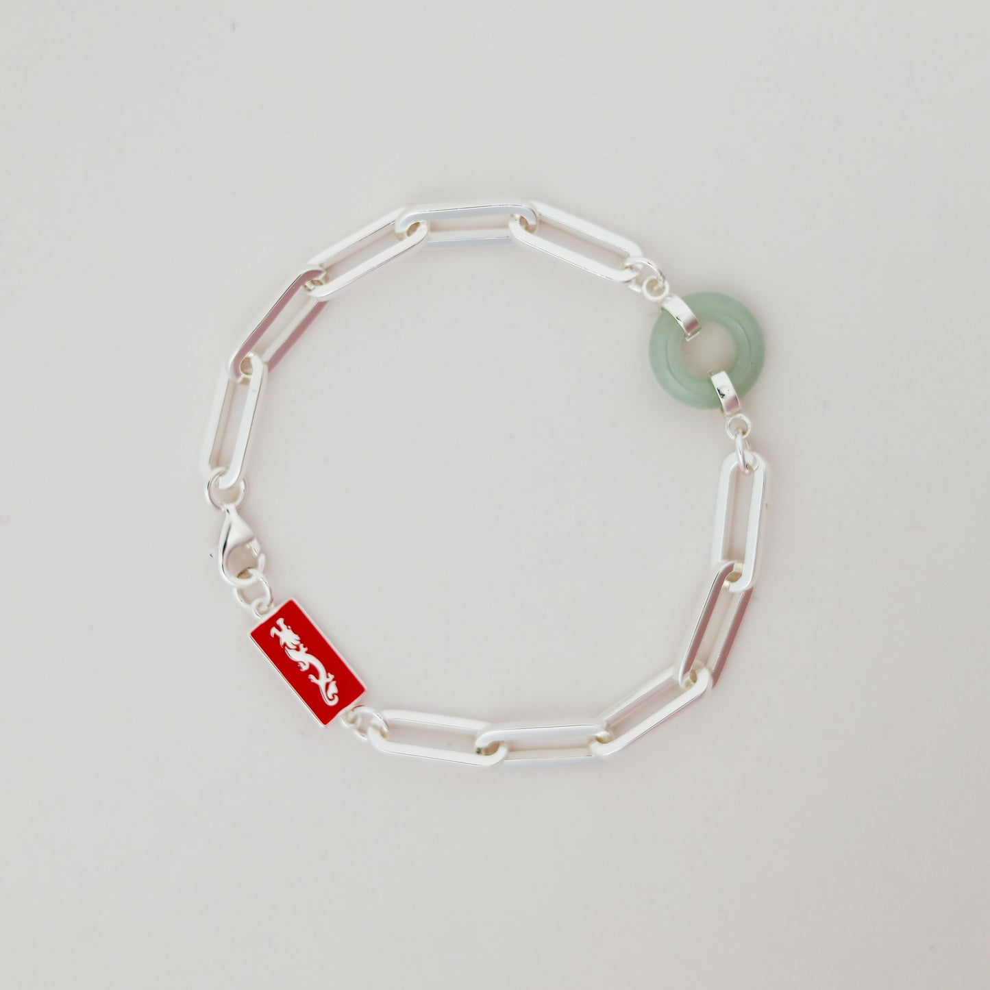 Dragon Happiness and Wealth Bracelet with Grade A Burmese jade, white gold, flat lay - Crowned