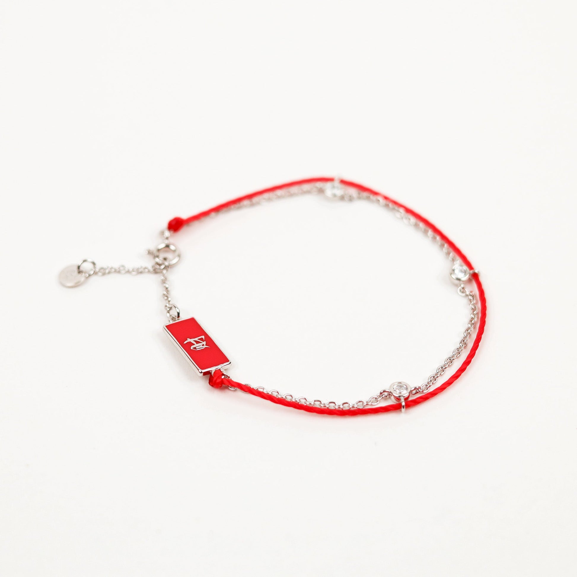 Gold Red String Good Luck Bracelet in 14k white gold, flat lay - Crowned jewelry