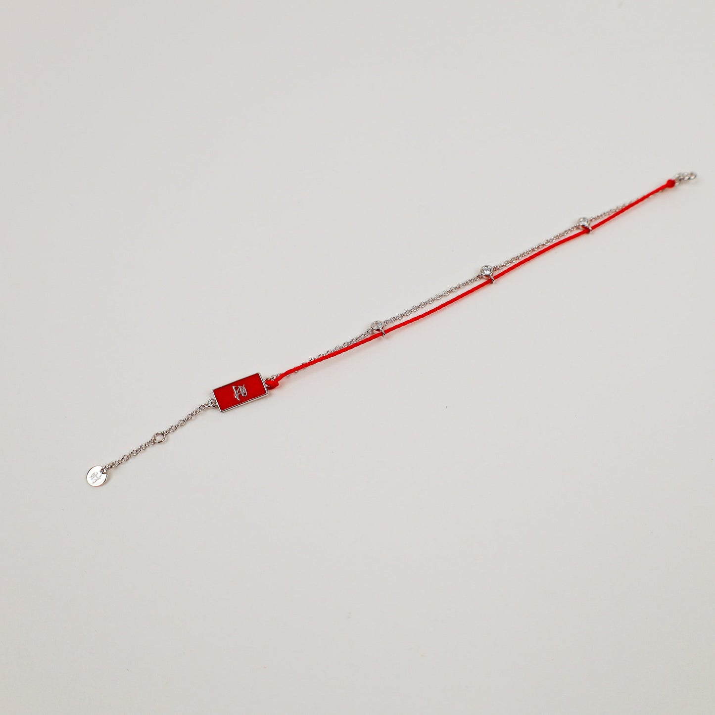 Gold Red String Good Luck Bracelet in 14k white gold, flat lay - Crowned jewelry