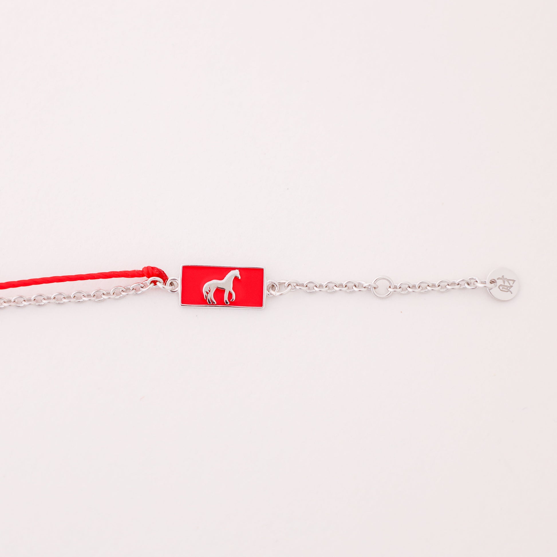 Horse zodiac red string bracelet with white gold chain, wrist view - Crowned