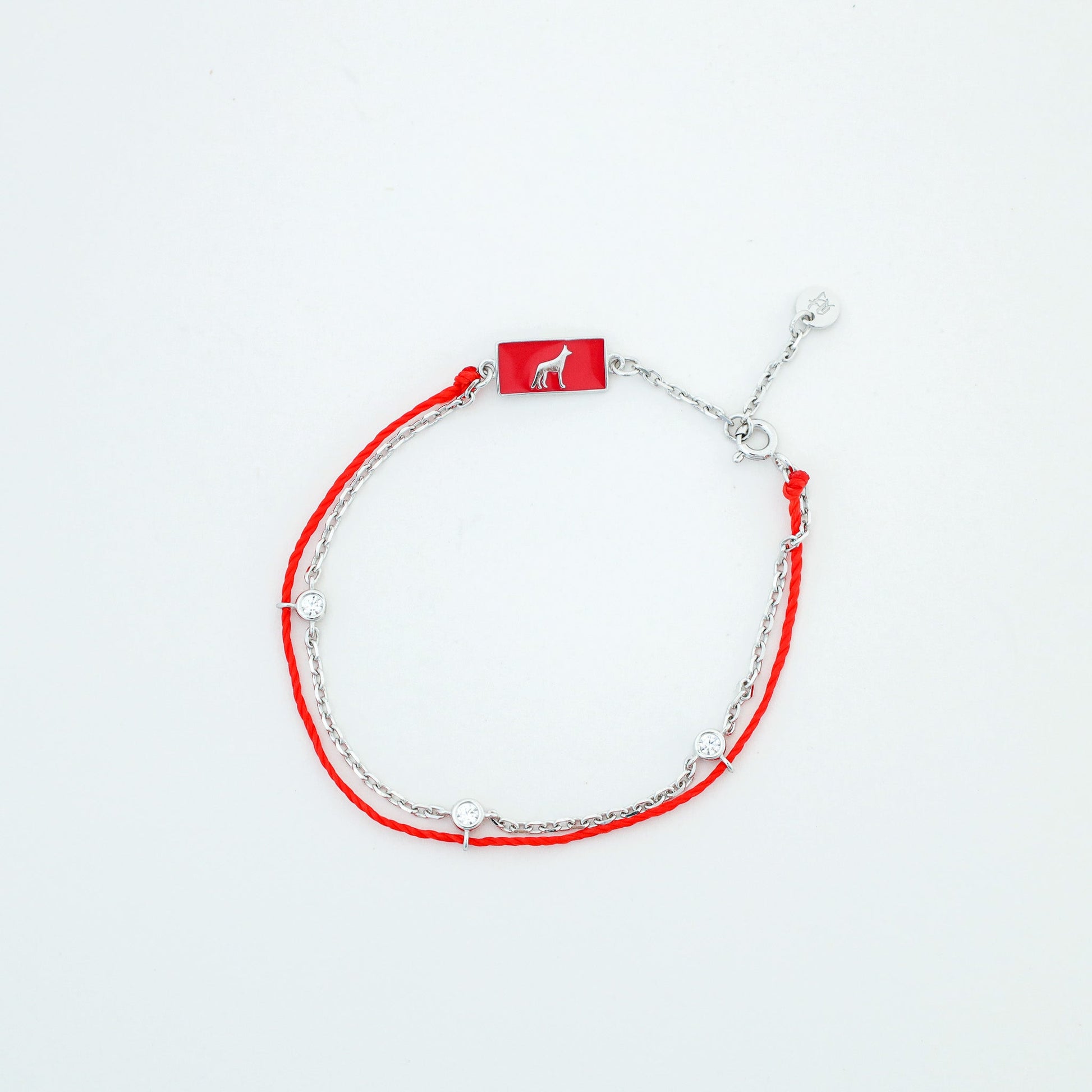 Dog zodiac red string bracelet with white gold chain, wrist view - Crowned