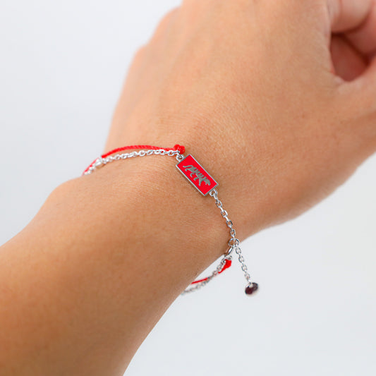 Tiger zodiac red string bracelet with silver chain, close-up detail - Crowned