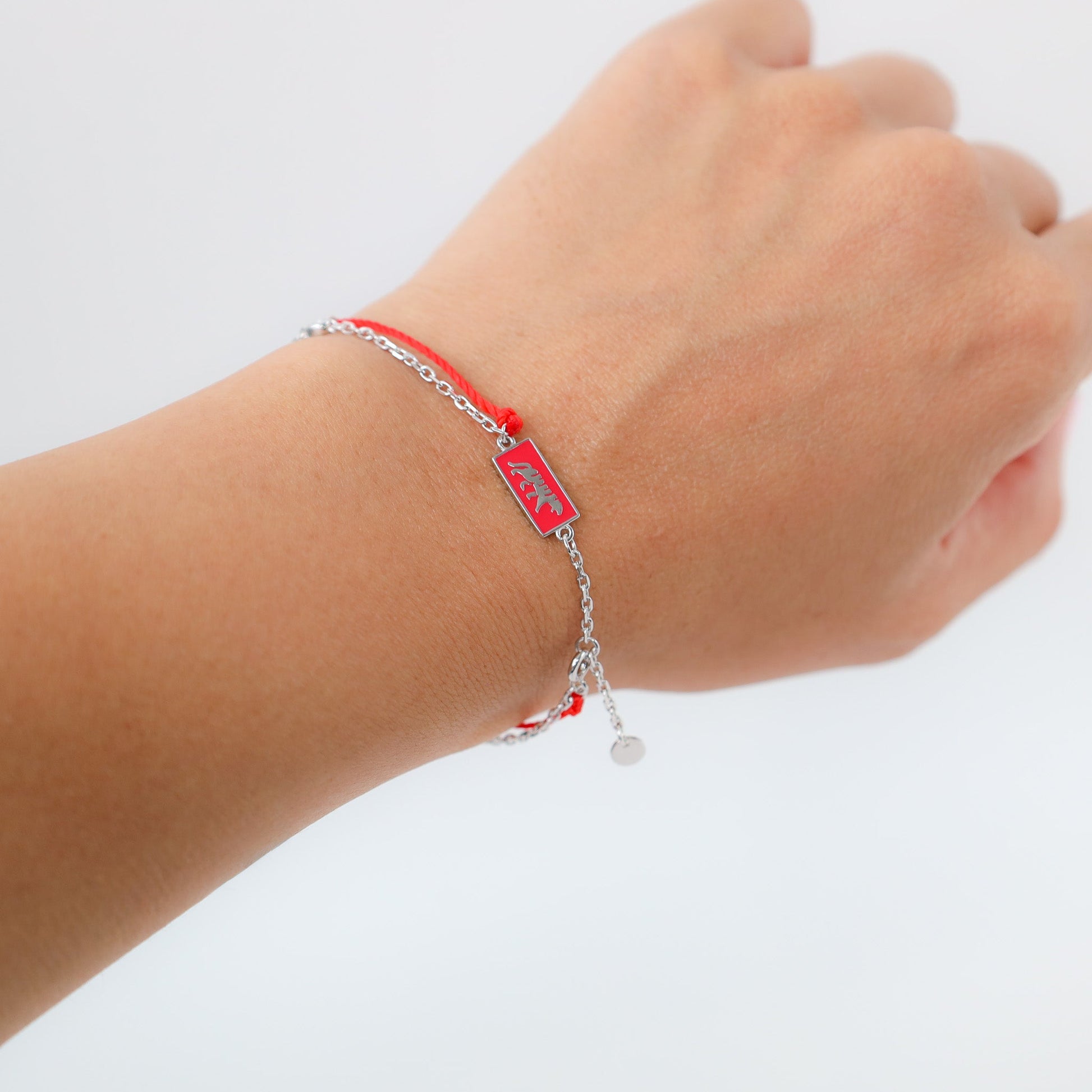 Tiger zodiac red string bracelet with white gold chain, flat lay - Crowned