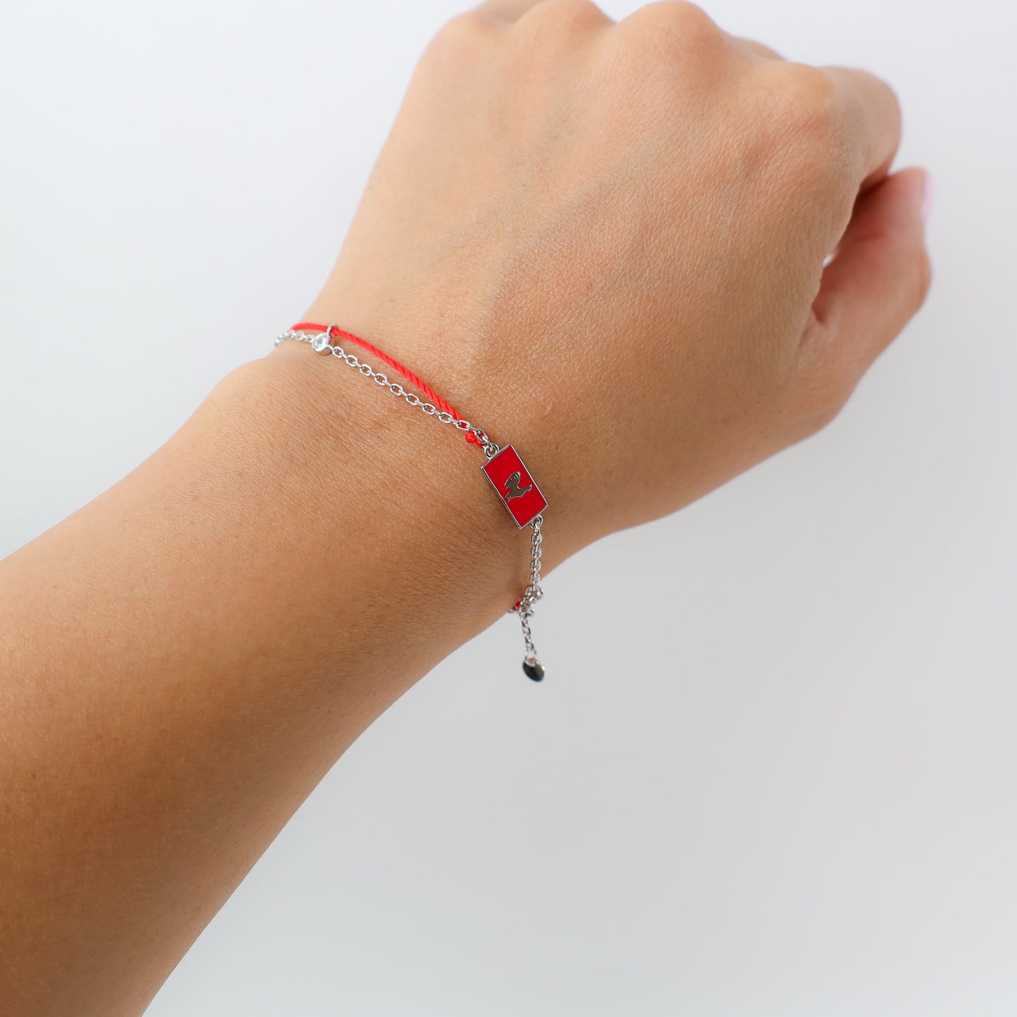 Rooster zodiac red string bracelet with silver chain, lifestyle shot - Crowned