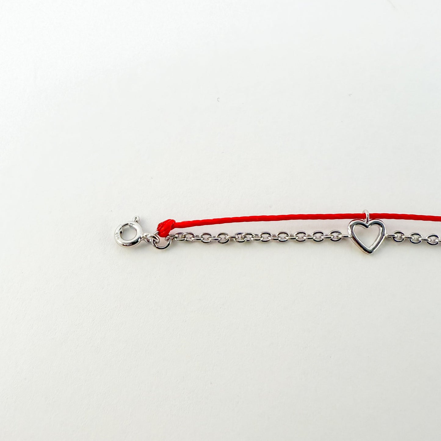 Heart Gold Red String Good Luck Bracelet in 14k white gold, flat lay - Crowned jewelry