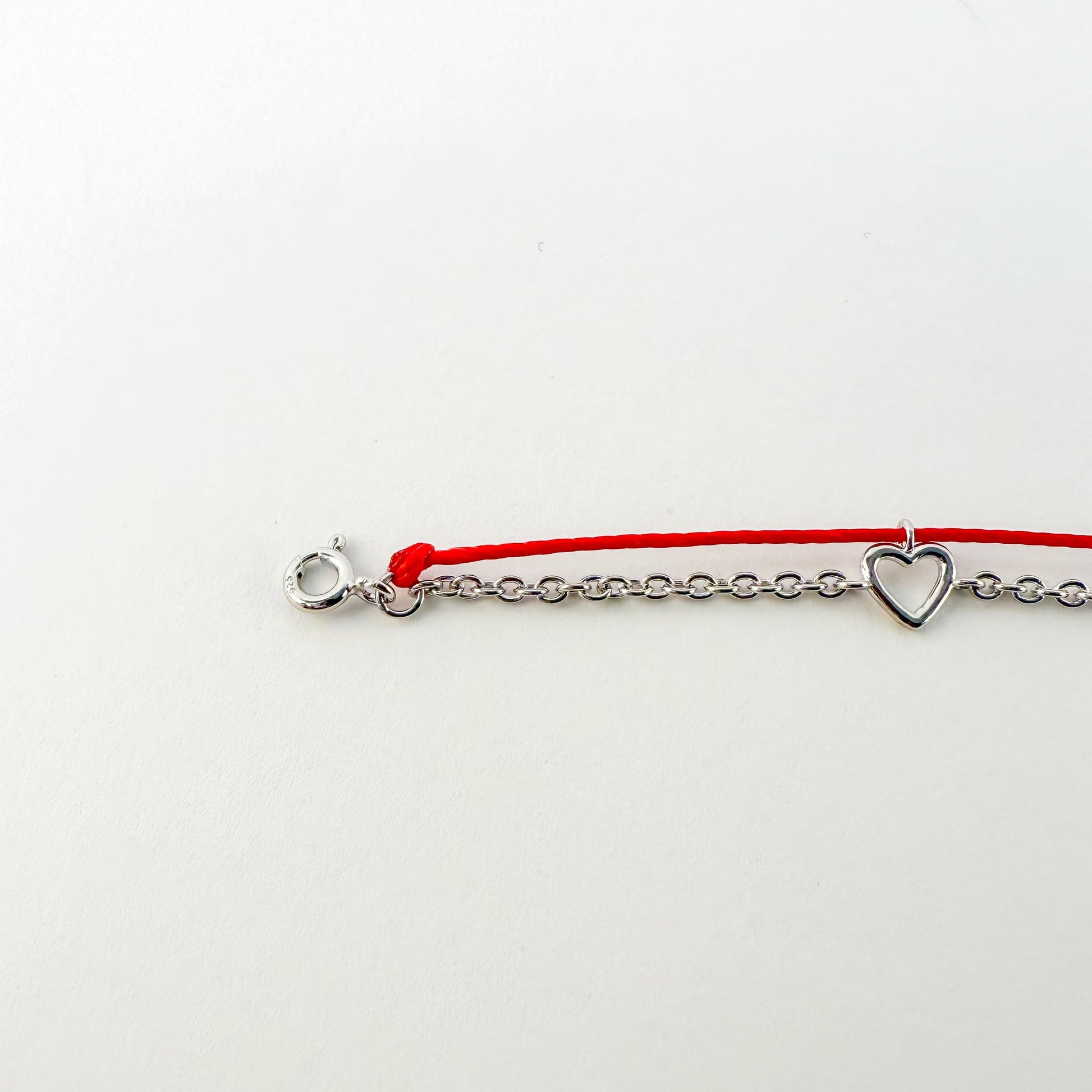 Heart Gold Red String Good Luck Bracelet in 14k white gold, flat lay - Crowned jewelry