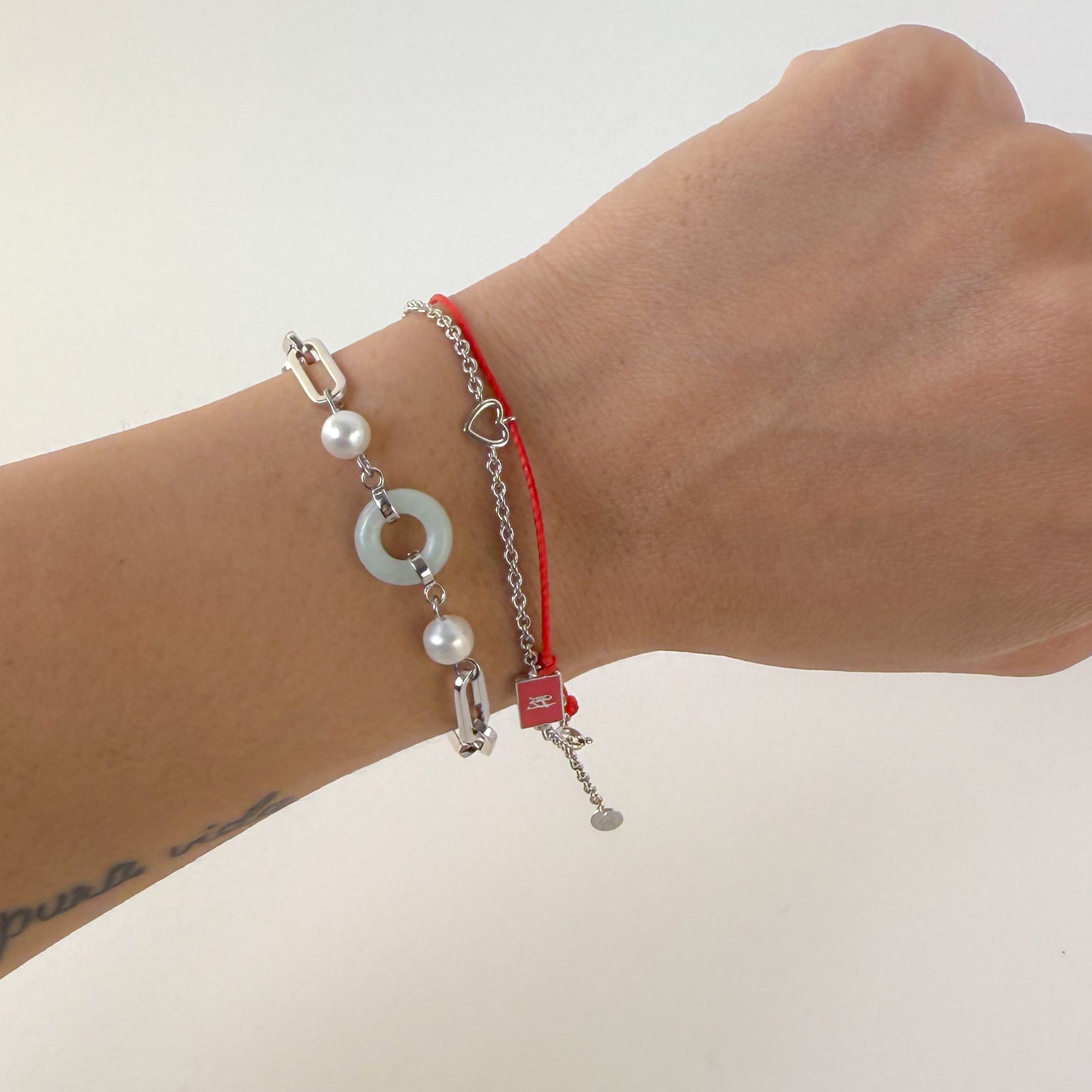Beauty and Affluence Bracelet with Grade A Burmese jade and freshwater pearls in 14k white gold, flat lay - Crowned