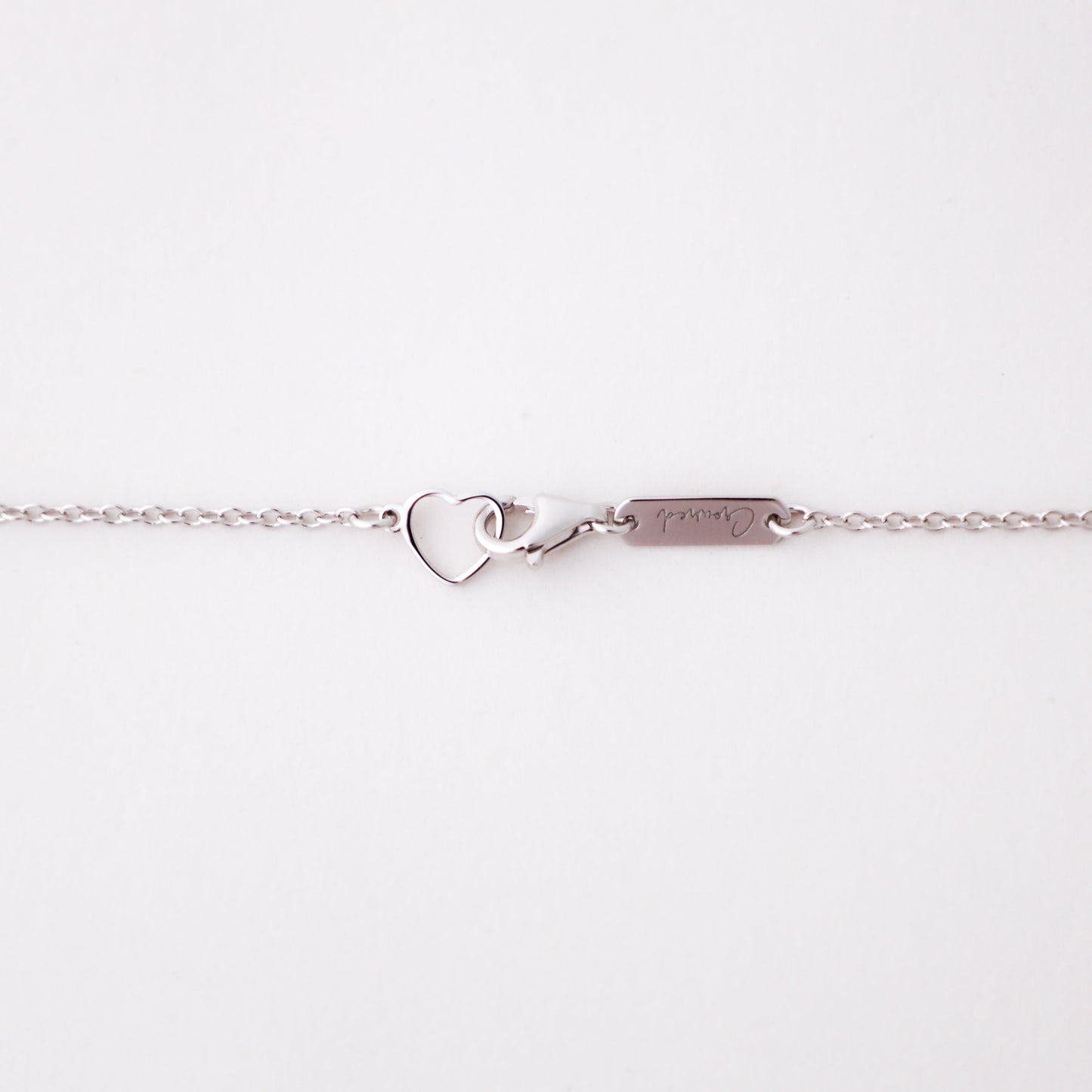Love and Grace Necklace, white gold delicate chain, close-up detail - Crowned