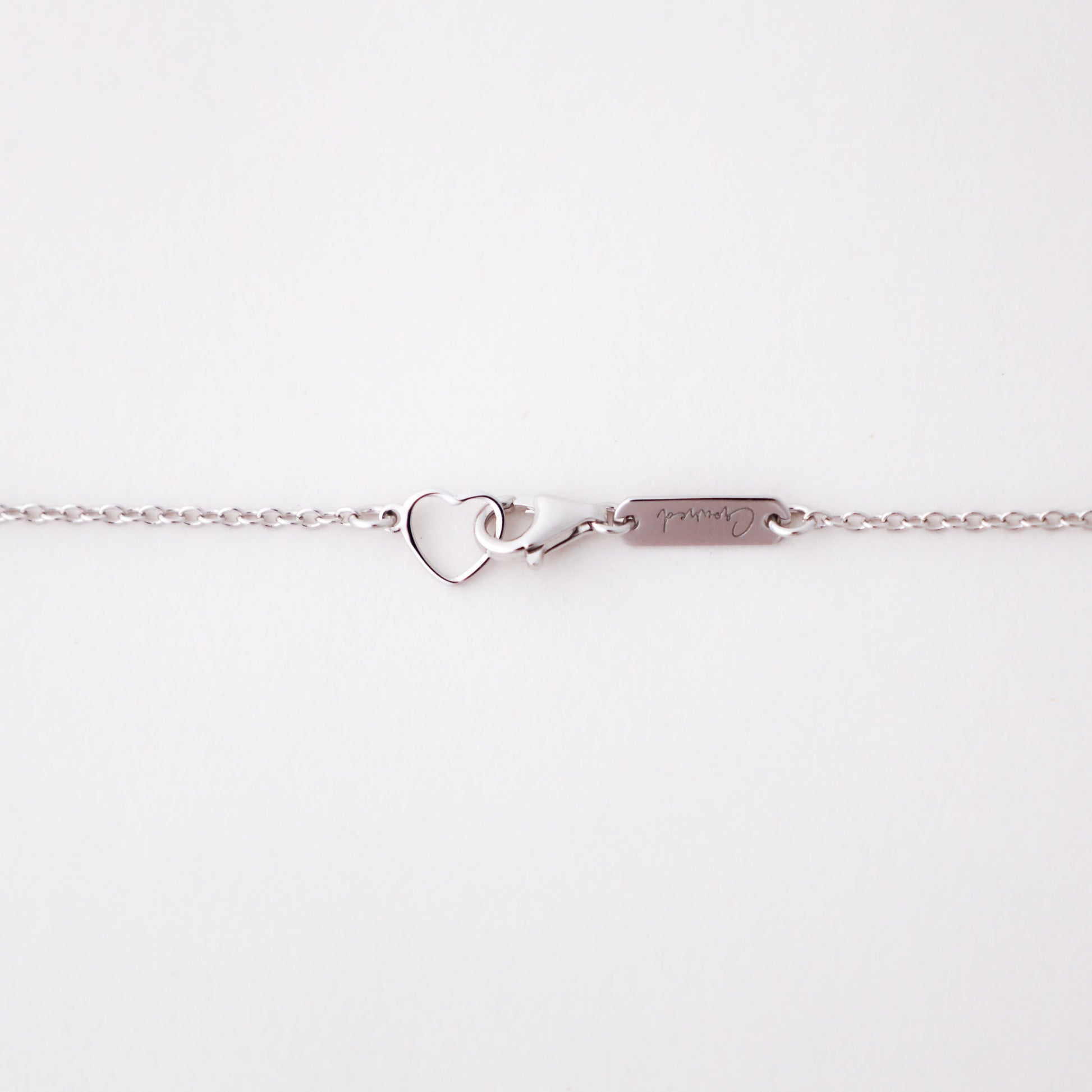 Love and Grace Necklace, white gold delicate chain, close-up detail - Crowned