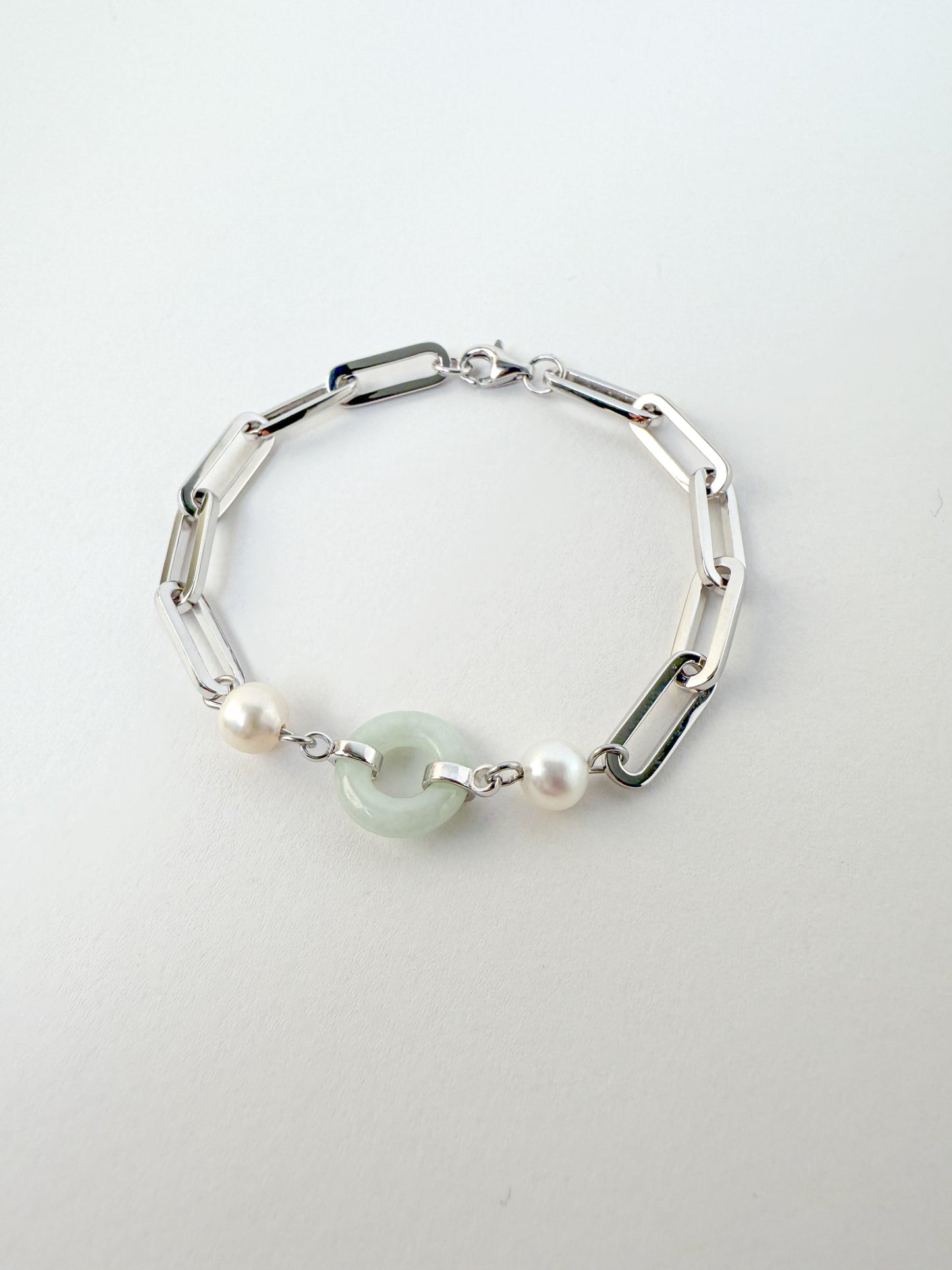 Beauty and Affluence Bracelet with Grade A Burmese jade and freshwater pearls in 14k white gold, flat lay - Crowned