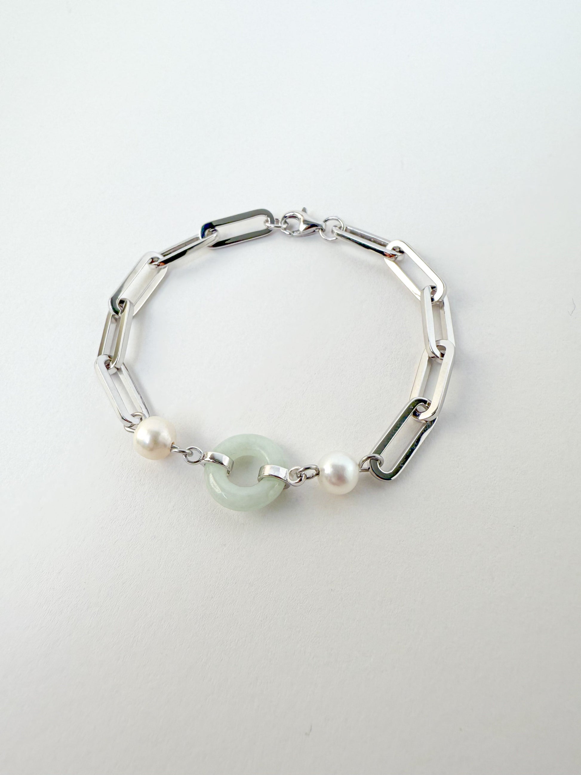 Beauty and Affluence Bracelet with Grade A Burmese jade and freshwater pearls in 14k white gold, flat lay - Crowned