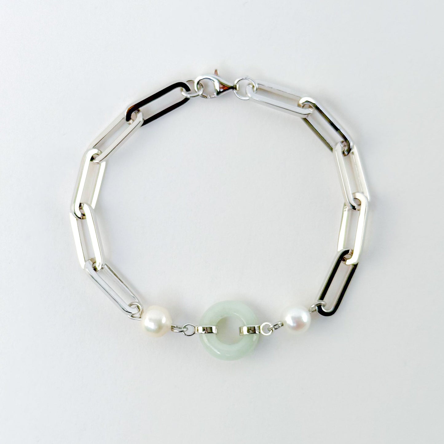 Beauty and Affluence Bracelet with Grade A Burmese jade and freshwater pearls in 14k white gold, flat lay - Crowned
