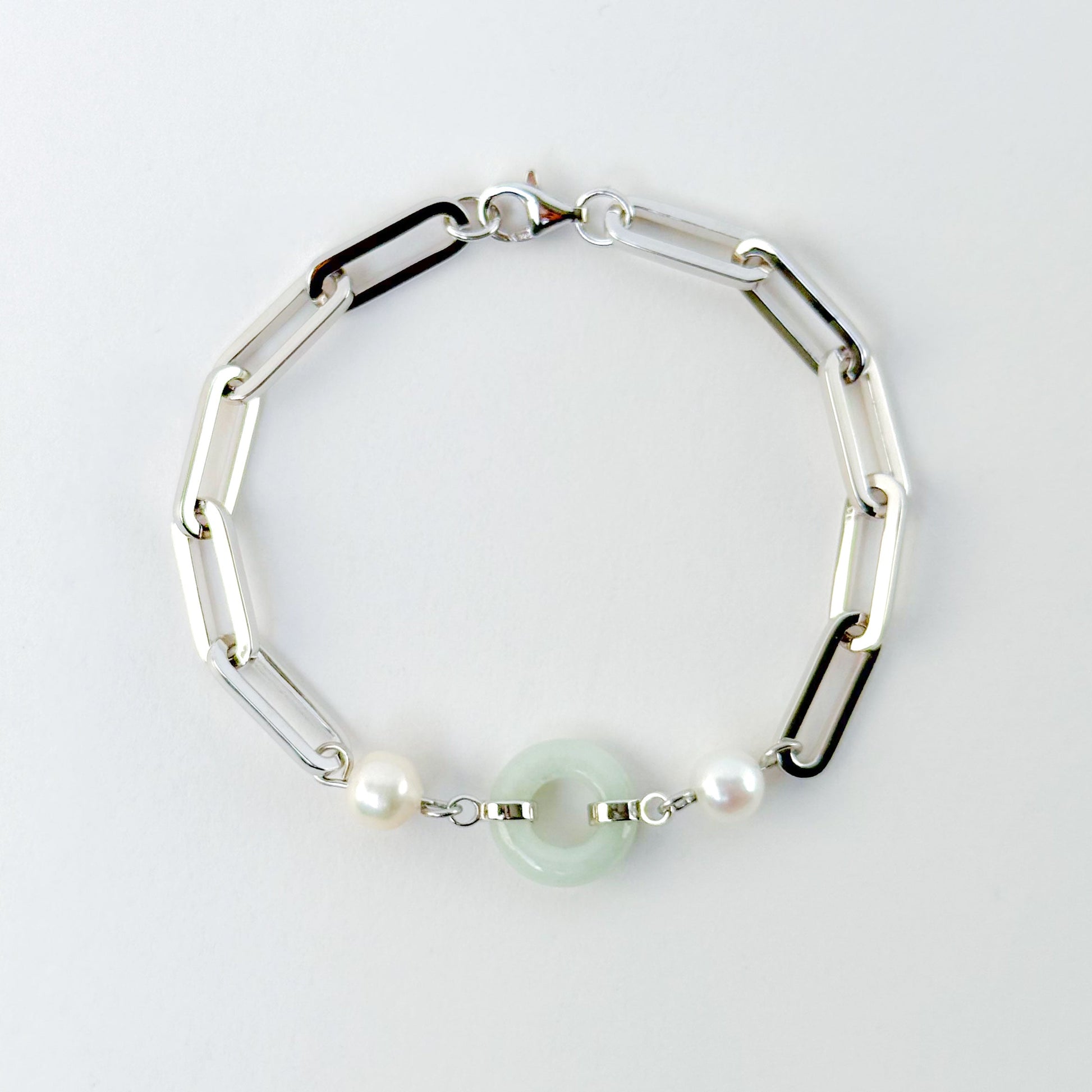 Beauty and Affluence Bracelet with Grade A Burmese jade and freshwater pearls in 14k white gold, flat lay - Crowned