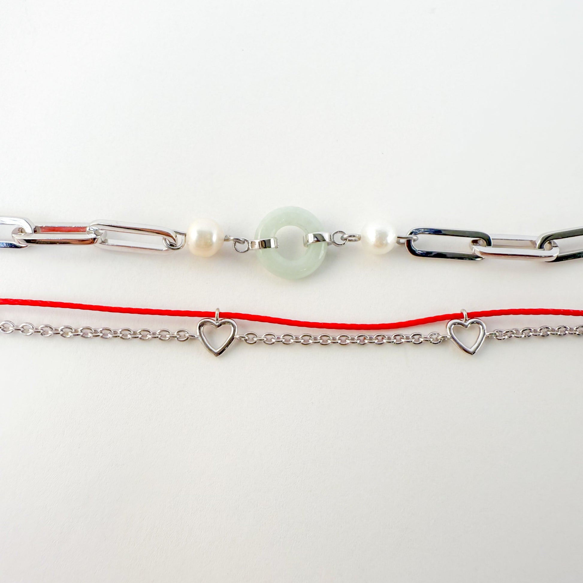 Heart Gold Red String Good Luck Bracelet in 14k white gold, flat lay - Crowned jewelry