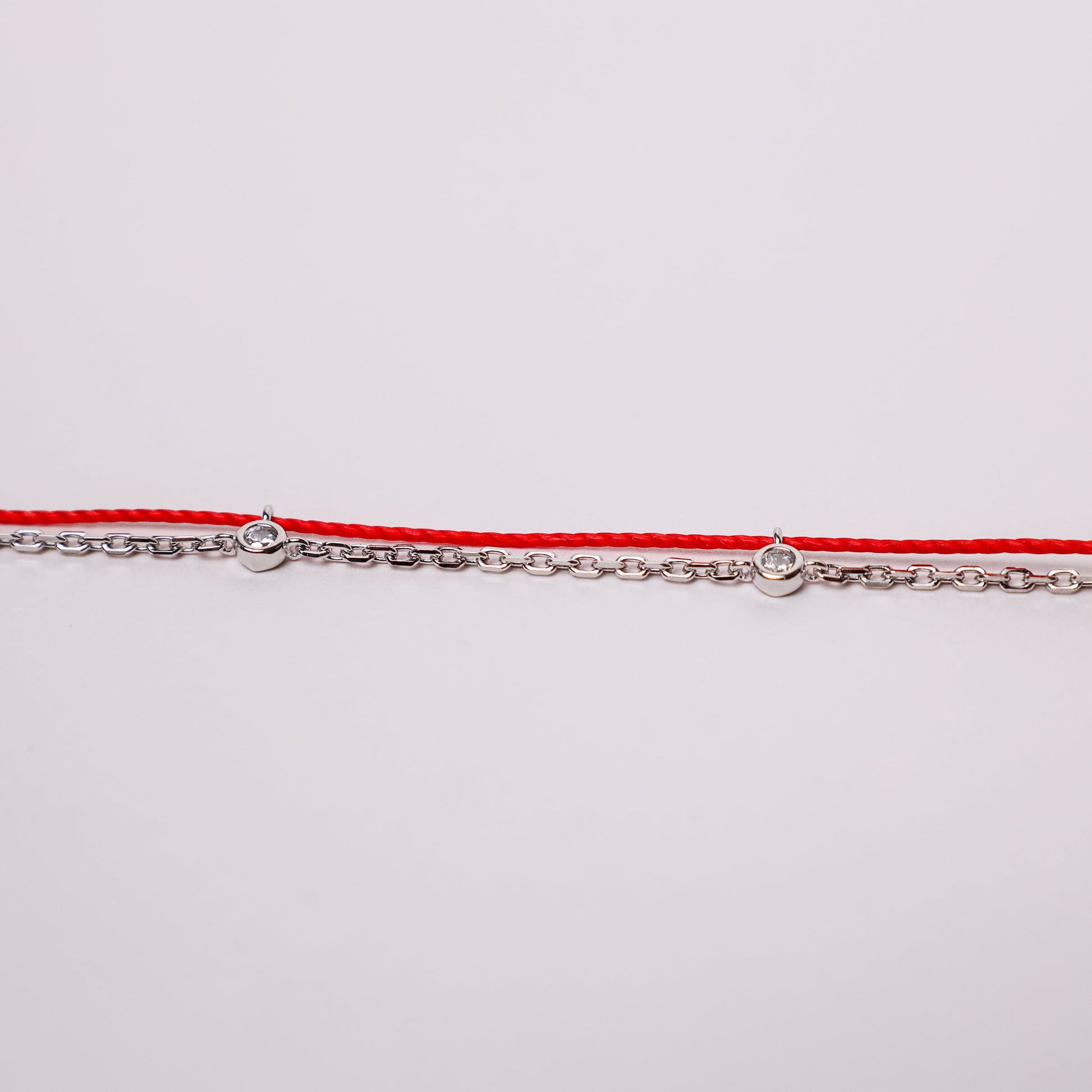 Dragon zodiac red string bracelet with white gold chain, wrist view - Crowned