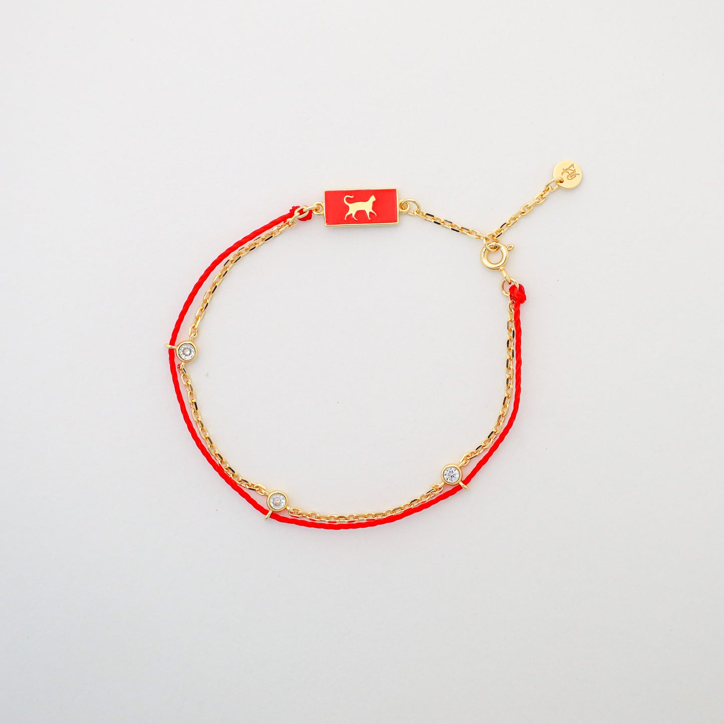 Cat zodiac red string bracelet with gold chain, lifestyle shot - Crowned