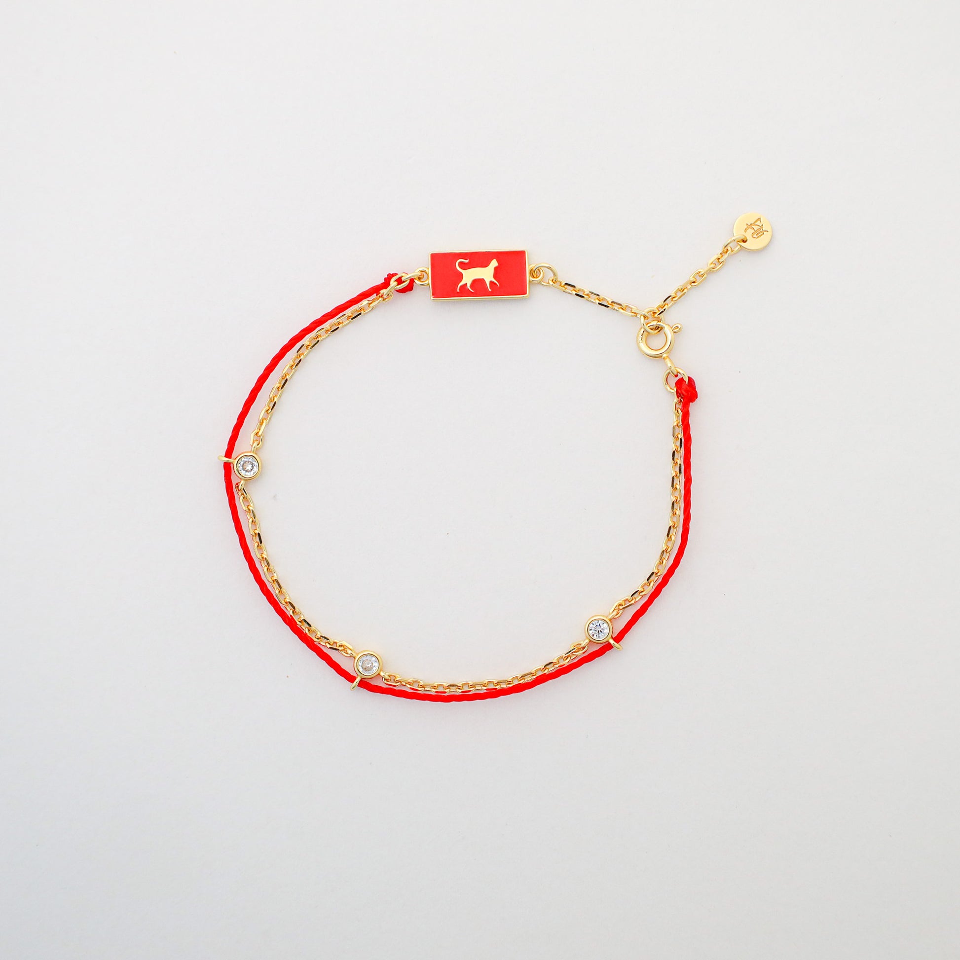 Cat zodiac red string bracelet with gold chain, lifestyle shot - Crowned
