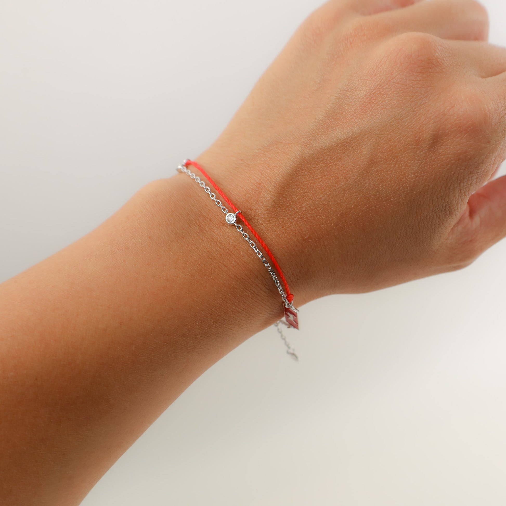 Cat zodiac red string bracelet with silver chain, lifestyle shot - Crowned