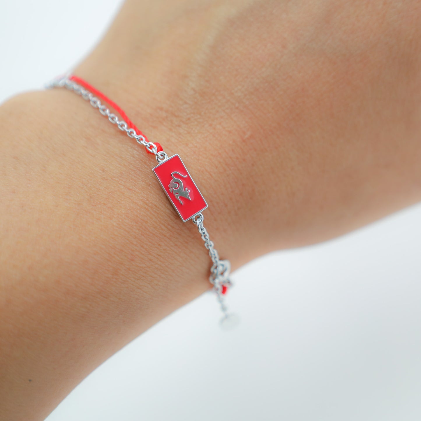 Rat zodiac red string bracelet with silver chain, close-up detail - Crowned